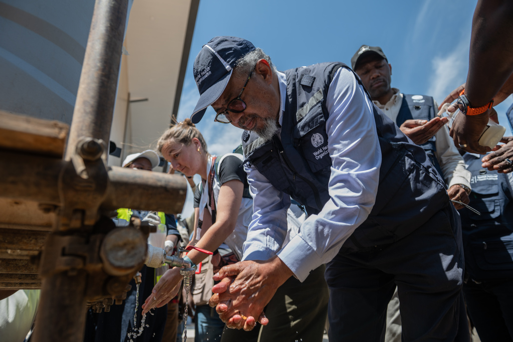 Director General of the World Health Organisation (WHO) Tedros Adhanom Ghebreyesus washes his hands upon his arrival in Bunia, Congo, Saturday, May 30, 2026. (AP Photo/Moses Sawasawa)