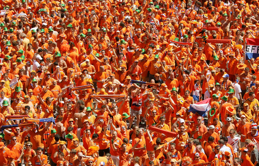 FILE - Dutch fans celebrate in preparation for the first match of their team at the special Dutch fan party area in Leipzig, eastern Germany, June 11, 2006. (AP Photo/Eckehard Schulz, File)