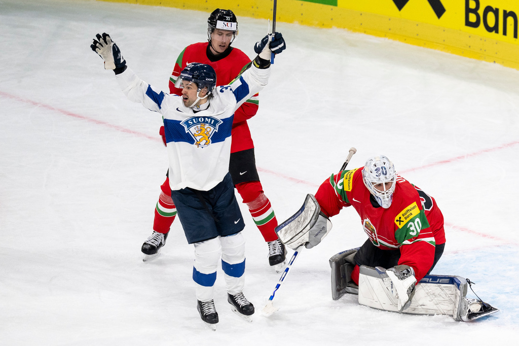 Finland's Eemil Erholtz celebrates the goal to make it 1: 3 from Finland's Janne Kuokkanen during the 2026 IIHF Men's Ice Hockey World Championship preliminary round group A game between Hungary and Finland, in Zurich, Switzerland, Saturday, May 16, 2026. (Andreas Becker/Keystone via AP)