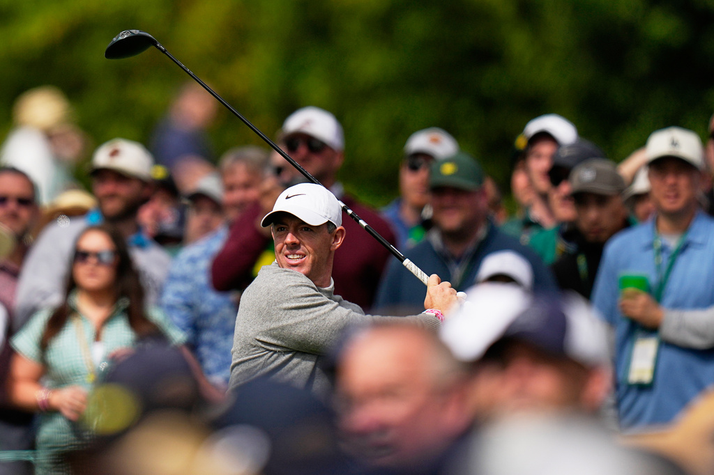 Rory McIlroy, of Northern Ireland, watches his tee shot on the 17th hole during a practice round ahead of the Masters golf tournament at the Augusta National Golf Club, Tuesday, April 7, 2026, in Augusta, Ga. (AP Photo/Eric Gay)