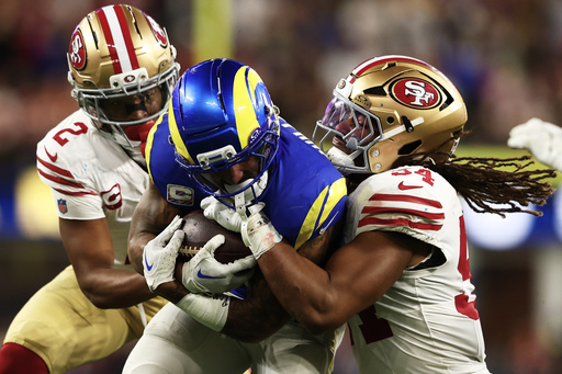 Los Angeles Rams running back Kyren Williams, middle, runs against San Francisco 49ers cornerback Deommodore Lenoir, left, and middle linebacker Fred Warner (54) during the second half of an NFL football game, Thursday, Oct. 2, 2025, in Inglewood, Calif. (AP Photo/Jessie Alcheh) Los Angeles Rams running back Kyren Williams, middle, runs against San Francisco 49ers cornerback Deommodore Lenoir, left, and middle linebacker Fred Warner (54) during the second half of an NFL football game, Thursday, Oct. 2, 2025, in Inglewood, Calif. (AP Photo/Jessie Alcheh)