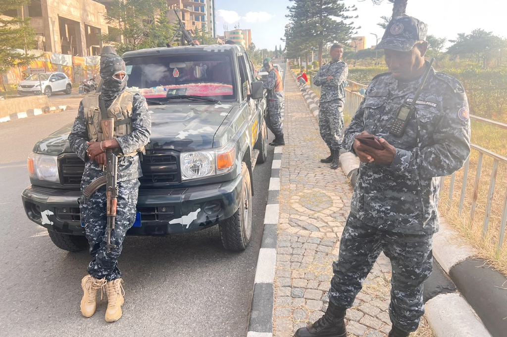 In this photo taken with a smartphone, Ethiopian federal police officers gather on a road in Mekelle, Tigray Region, Ethiopia, Thursday, Oct. 8, 2026. (AP Photo/Filmon Equar Hailu)