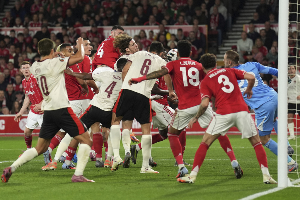 Midtjylland's Mads Sorensen, center, scores during the Europa League soccer match between Nottingham Forest and Midtjylland at the City Ground, Nottingham, England, Thursday Oct. 2, 2025. (Joe Giddens/PA via AP)