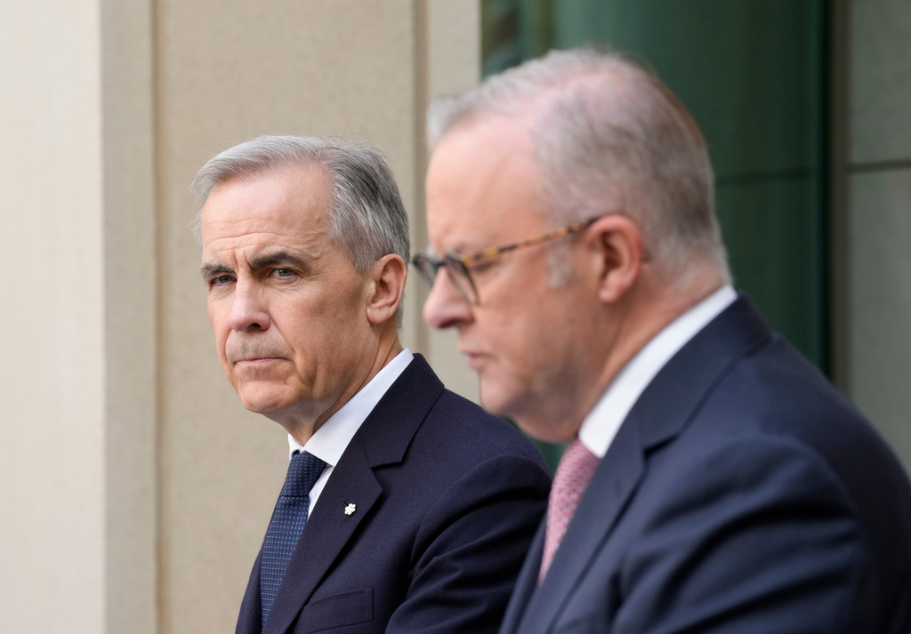 Canada's Prime Minister Mark Carney, left, and Australian Prime Minister Anthony Albanese participate in a joint news conference, in Canberra, Australia, Thursday, March 5, 2026. (Adrian Wyld/The Canadian Press via AP)