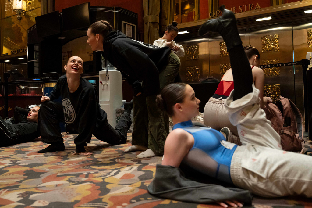 Dancers warm up and stretch before an audition for the Radio City Rockettes at Radio City Music Hall in New York, on Wednesday, April 22, 2026. (AP Photo/Yuki Iwamura)