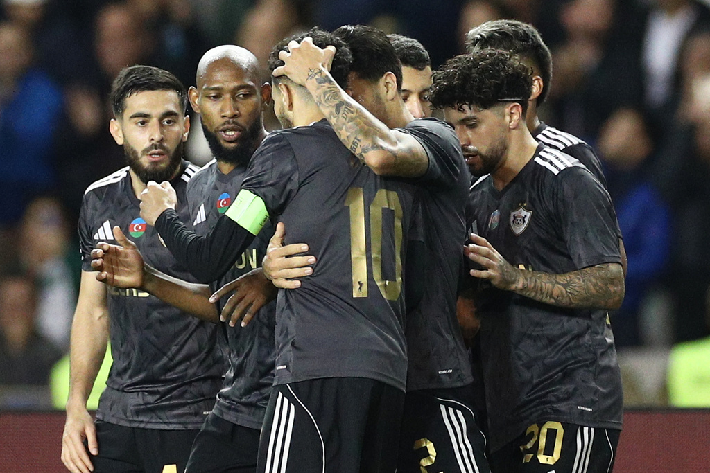 Qarabag's players celebrate their side's first goal scored by Abdellah Zoubir, center, during the Champions League opening phase soccer match between Qarabag and FC Copenhagen at the Tofiq Bahramov stadium in Baku, Azerbaijan, Wednesday, Oct. 1, 2025. (AP Photo)