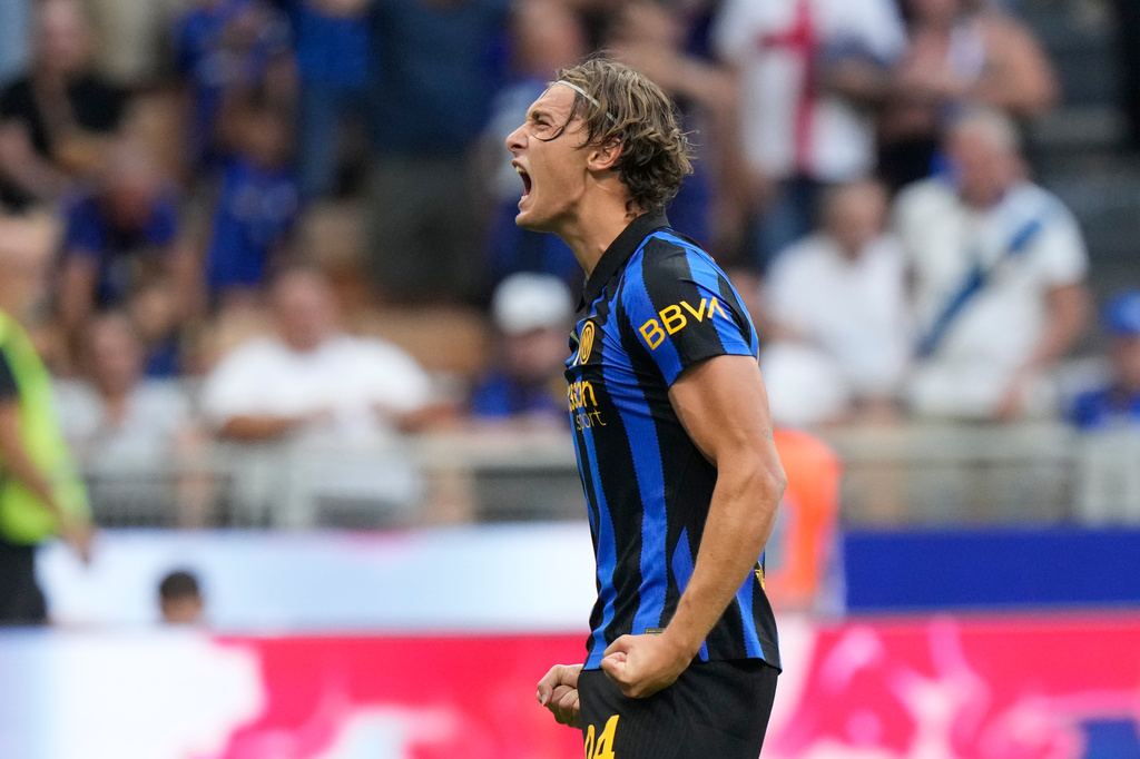 Inter Milan's Francesco Pio Esposito celebrates after scoring his side's third goal during a Serie A soccer match between Inter Milan and Monza, in Milan, Italy, Saturday, Aug. 22, 2026. (AP Photo/Luca Bruno)