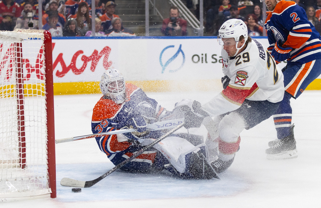 Florida Panthers' Cole Reinhardt (29) scores a goal on Edmonton Oilers' goalie Connor Ingram (39) during first period NHL action, in Edmonton on Thursday, March 19, 2026. (Jason Franson/The Canadian Press via AP)