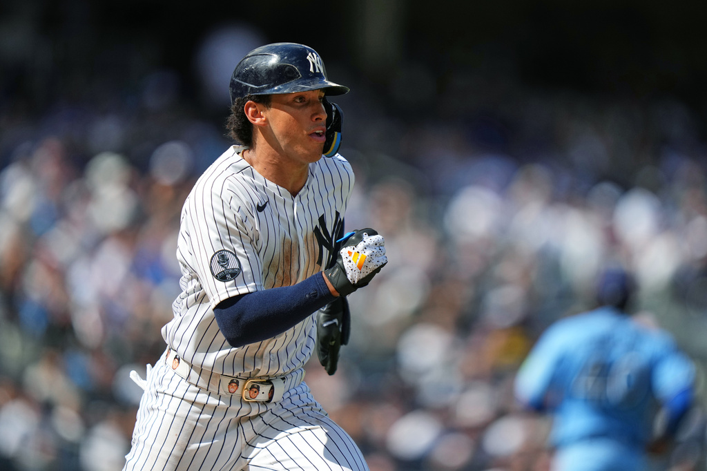 New York Yankees' George Lombard Jr. hits a single during the sixth inning of a baseball game against the Toronto Blue Jays Sunday, Aug. 23, 2026, in New York. (AP Photo/Frank Franklin II)