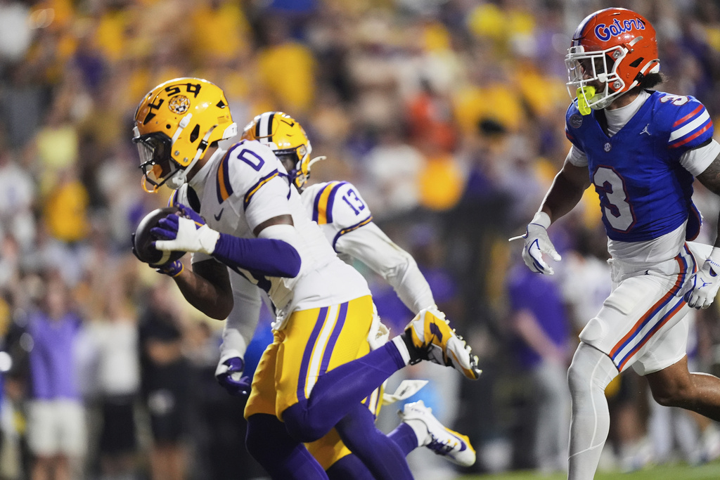 LSU safety Tamarcus Cooley (0) returns an interception in the second half of an NCAA college football game against Florida, Saturday, Sept. 13, 2025, in Baton Rouge, La. (AP Photo/Gerald Herbert)
