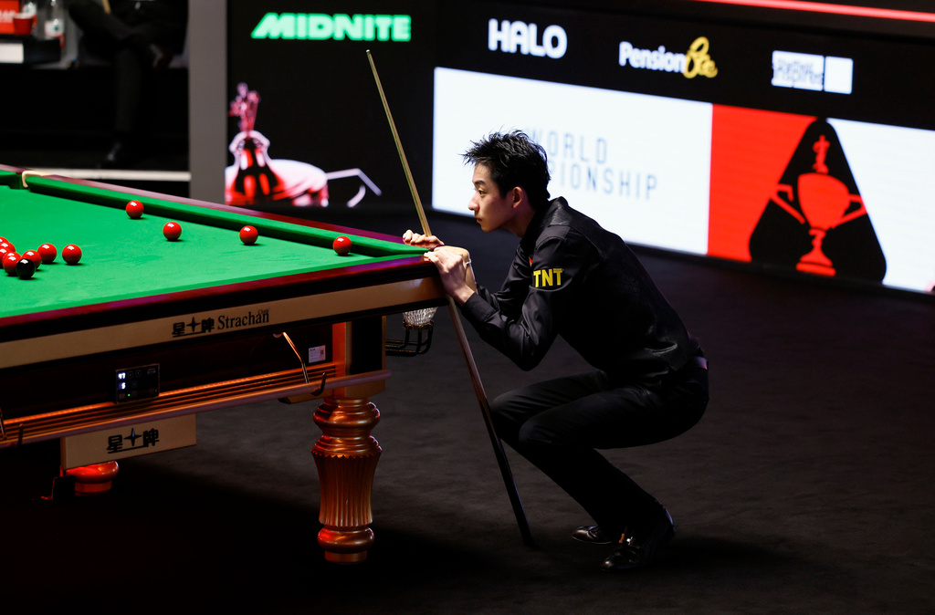 China's Wu Yize in action, during his semi-final match against Northern Ireland's Mark Allen on day fifteen of the World Snooker Championship 2026, in Sheffield, England, Saturday May 2, 2026. (Richard Sellers/PA via AP)