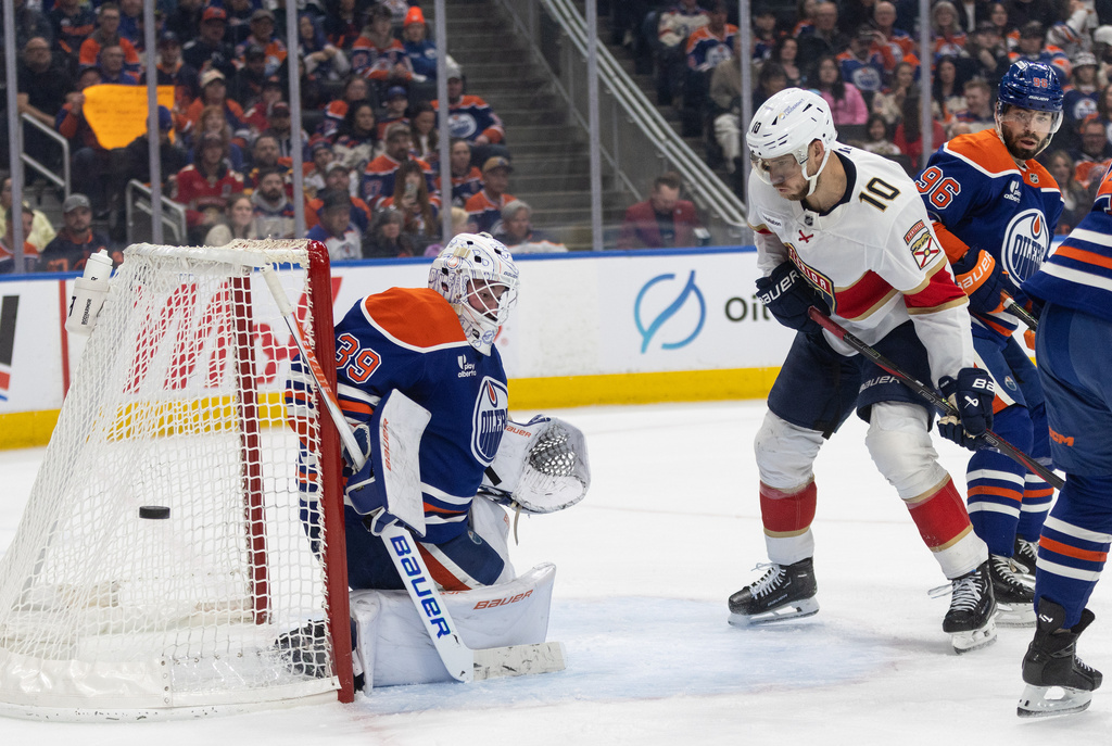 Florida Panthers' A.J. Greer (10) is stopped by Edmonton Oilers' goalie Connor Ingram (39) during first period NHL action, in Edmonton on Thursday, March 19, 2026. (Jason Franson/The Canadian Press via AP)