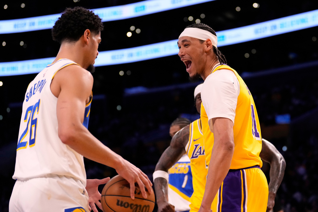Los Angeles Lakers center Jaxson Hayes, right, jokes with Indiana Pacers guard Ben Sheppard after dunking during the first half of an NBA basketball game Friday, March 6, 2026, in Los Angeles. (AP Photo/Mark J. Terrill)