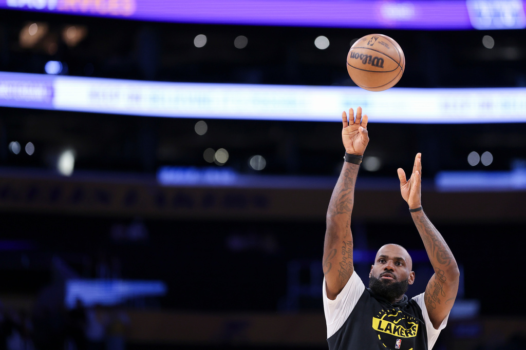 Los Angeles Lakers forward LeBron James warms up before an NBA basketball game against the Phoenix Suns, Friday, April 10, 2026, in Los Angeles. (AP Photo/Jessie Alcheh)