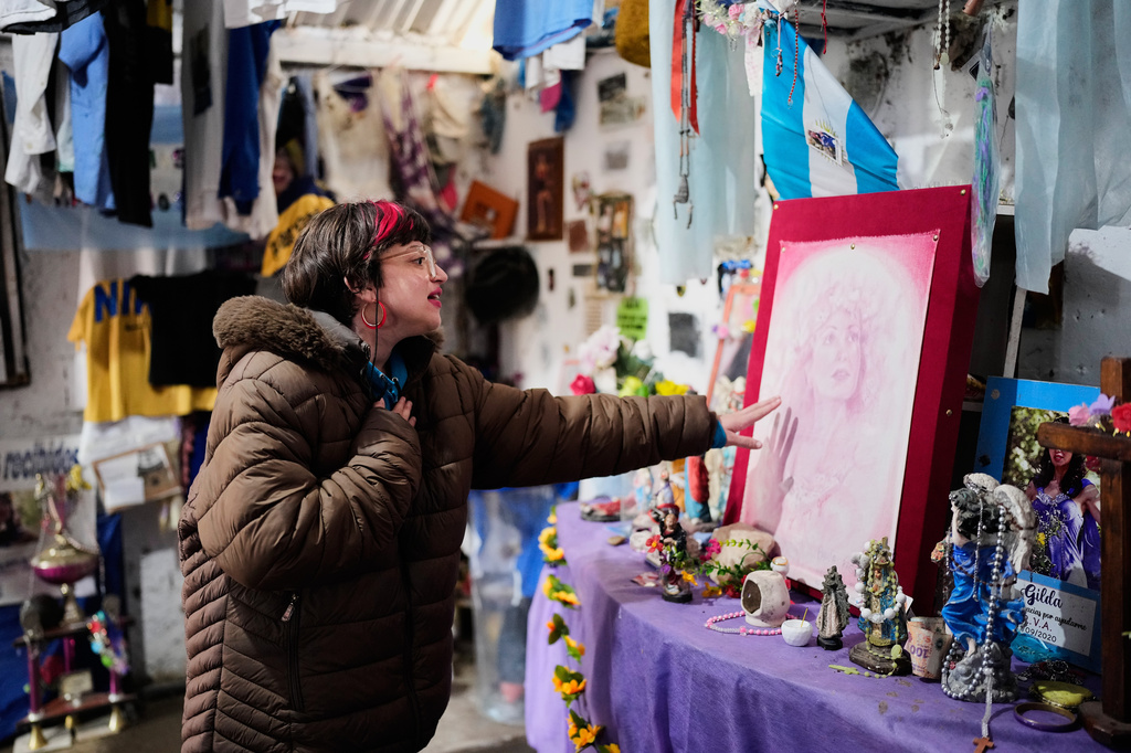 A person prays at a sanctuary dedicated to late Argentine singer Gilda on the 30th anniversary of her death in a bus crash, in Entre Rios, Argentina, Monday, Sept. 7, 2026. (AP Photo/Natacha Pisarenko)