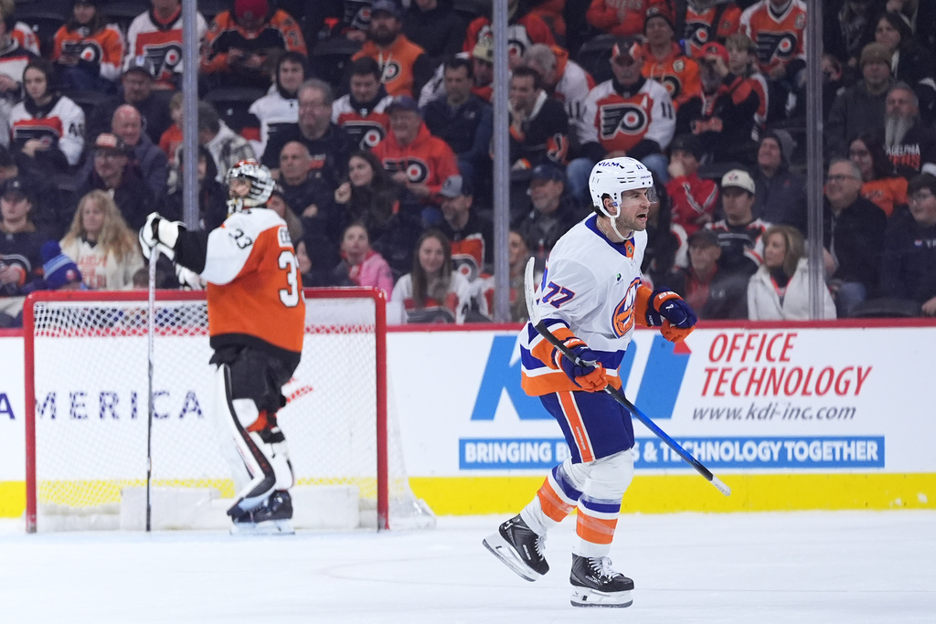 New York Islanders' Tony DeAngelo, right, reacts after scoring against Philadelphia Flyers' Samuel Ersson during the second period of an NHL hockey game Monday, Jan. 26, 2026, in Philadelphia. (AP Photo/Matt Slocum)