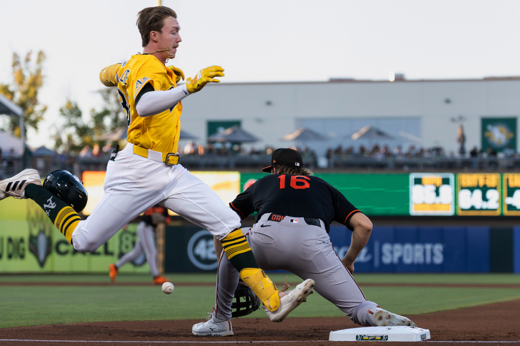 Baltimore Orioles first baseman Coby Mayo (16) puts out Athletics' Henry Bolte, left, during the second inning of a baseball game Saturday, Aug. 29, 2026, in West Sacramento, Calif. (AP Photo/Sara Nevis)