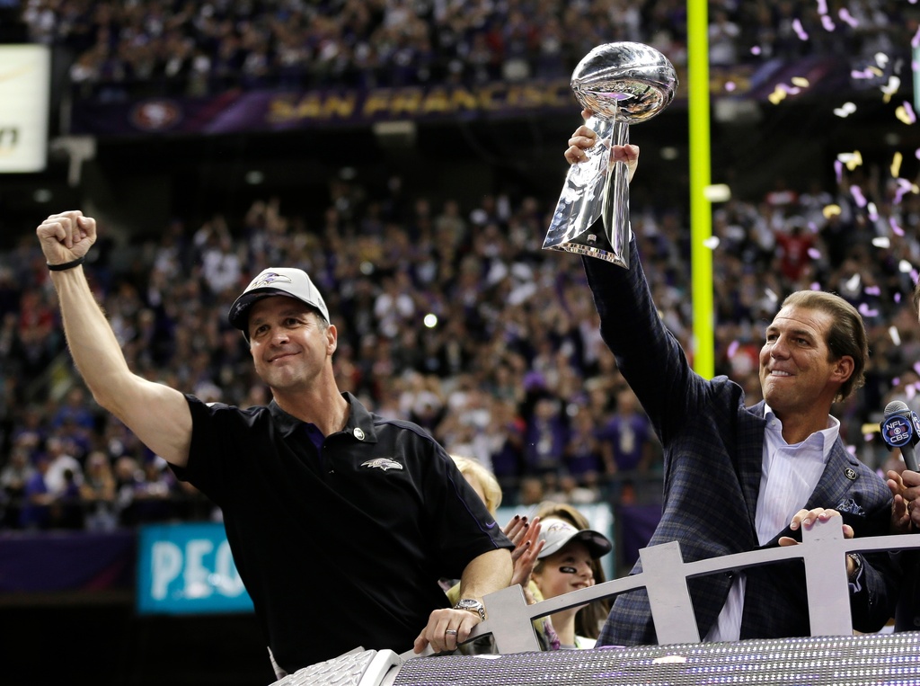 FILE -Baltimore Ravens owner Stephen J. Bisciotti, right, holds up the Vince Lombardi Trophy as he and head coach John Harbaugh celebrate the team's 34-31win against the San Francisco 49ers in the NFL Super Bowl XLVII football game, Sunday, Feb. 3, 2013, in New Orleans. (AP Photo/Matt Slocum, File)