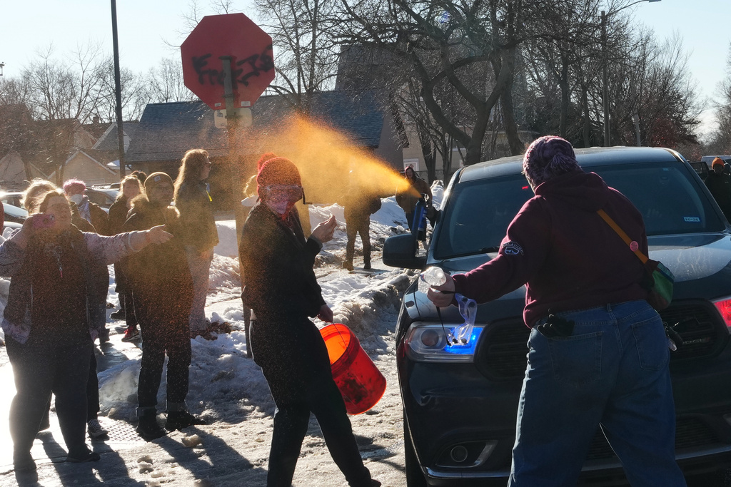 A protester is sprayed with pepper spray by a Federal agent Tuesday, Jan. 13, 2026, in Minneapolis.(AP Photo/Adam Gray)