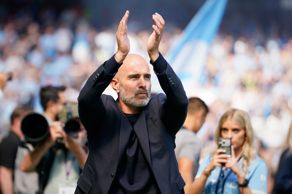 Manchester City's head coach Enzo Maresca greets fans ahead of the English Premier League soccer match between Manchester City and Bournemouth in Manchester, England, Sunday, Aug. 23, 2026. (AP Photo/Dave Thompson)