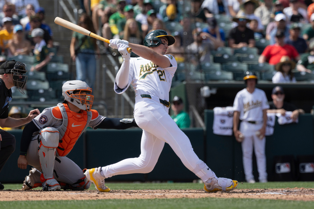 Athletics' Tyler Soderstrom (21) hits a three-run triple during the fifth inning of a baseball game against the Houston Astros, Sunday, April 5, 2026, in West Sacramento, Calif. (AP Photo/Sara Nevis)