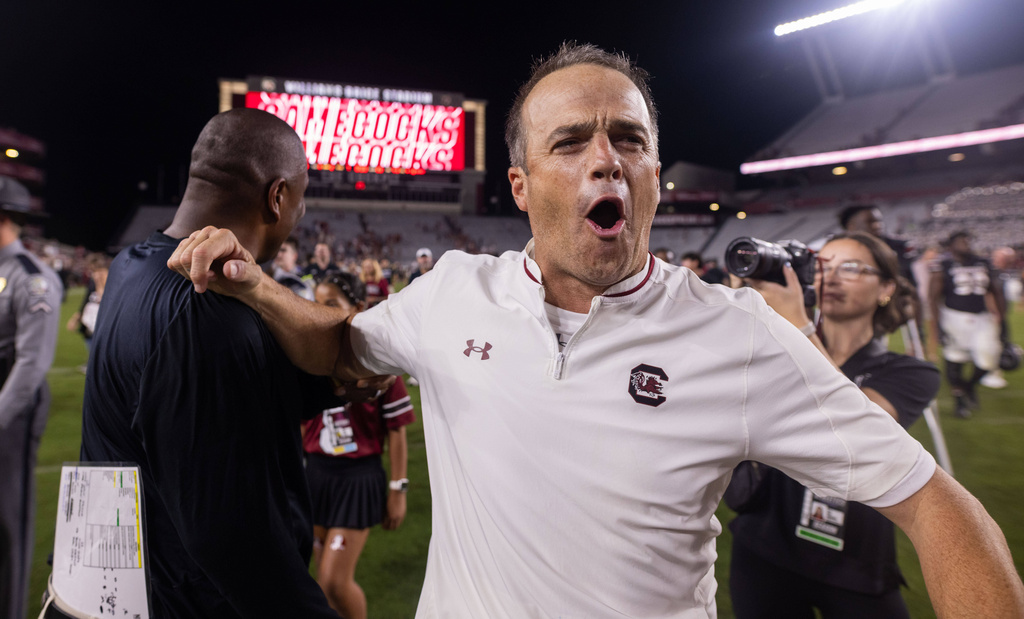 South Carolina head coach Shane Beamer celebrates after defeating Kentucky in an NCAA college football game, Saturday, Sept. 27, 2025, in Columbia, S.C. (AP Photo/Scott Kinser)