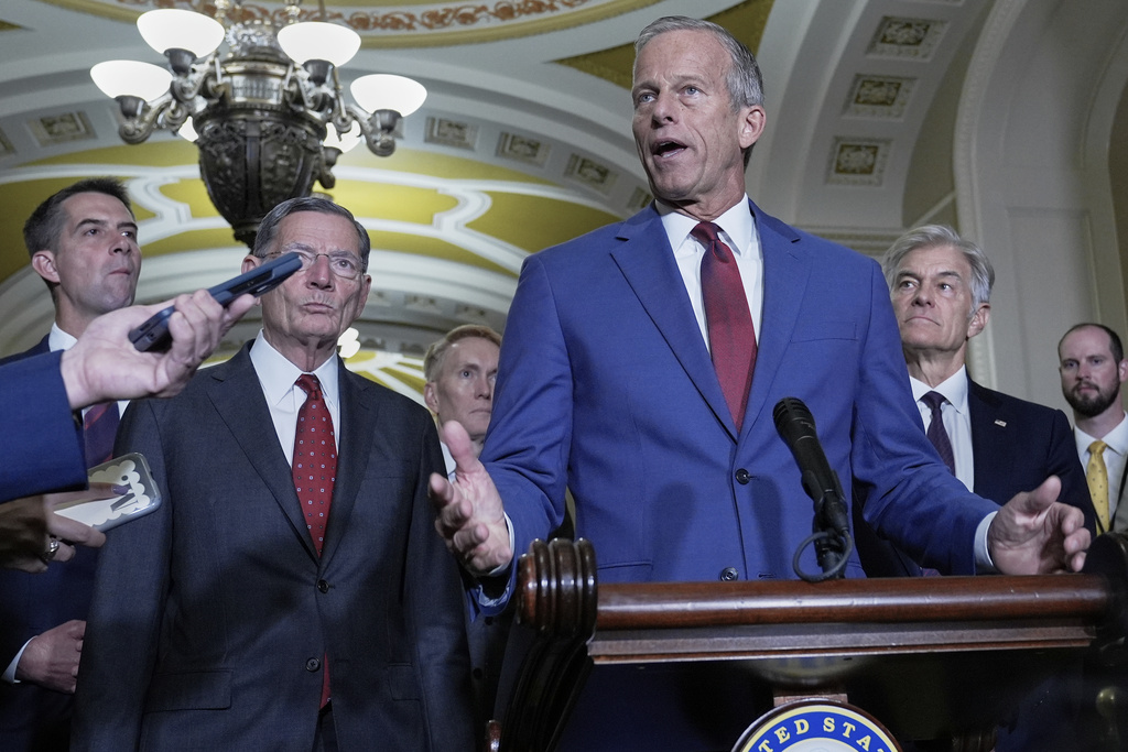 Sen. Majority Leader John Thune, R-S.D., center, speaks during a news conference after a policy luncheon at the Capitol, Tuesday, Sept. 16, 2025, in Washington. (AP Photo/Mariam Zuhaib)