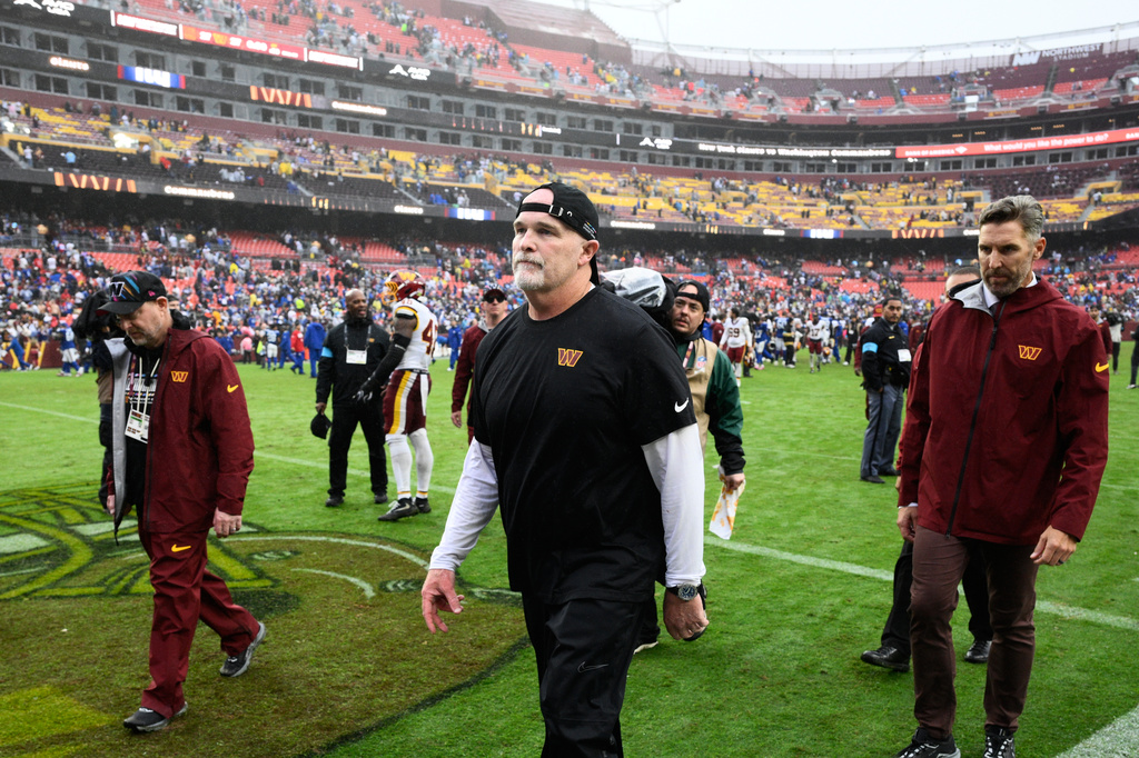 Washington Commanders head coach Dan Quinn leaves the field after an NFL football game against the New York Giants in Landover, Md., Sunday, Oct. 11, 2026. (AP Photo/Nick Wass)