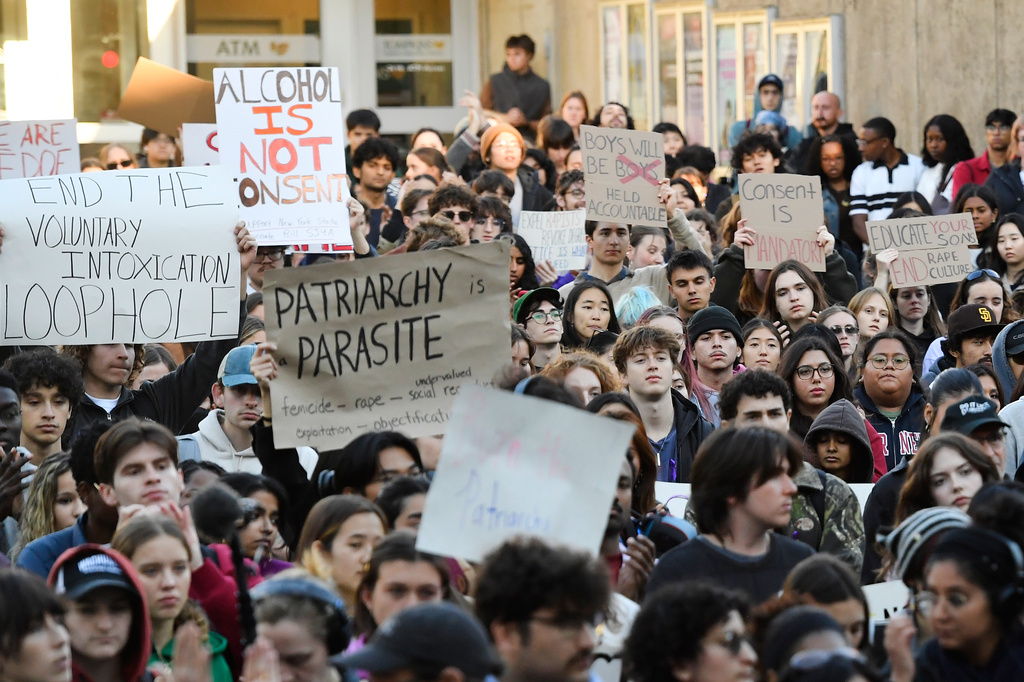 Demonstrators attend a protest against Cornell University's handling of the 2024 fraternity-house gang rape allegations at the campus, Monday, Oct. 5, 2026, in Ithaca, N.Y. (AP Photo/Adrian Kraus)