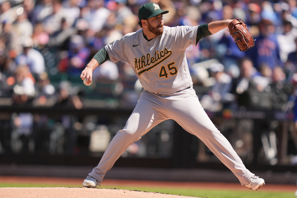 Oakland Athletics pitcher Aaron Civale throws during the first inning of a baseball game against the New York Mets, Sunday, April 12, 2026, in New York. (AP Photo/Seth Wenig)