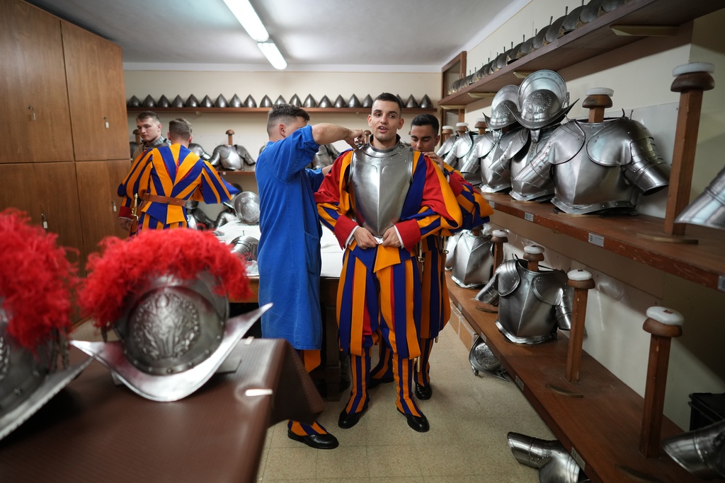 Pontifical Swiss Guards prepare ahead of their swearing in ceremony, at the Vatican, Saturday, Oct. 4, 2025. (AP Photo/Andrew Medichini)