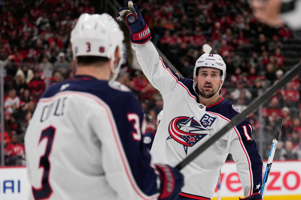 Columbus Blue Jackets' Miles Wood celebrates his goal during the third period of an NHL hockey game against the New Jersey Devils in Newark, N.J., Monday, Dec. 1, 2025. (AP Photo/Seth Wenig)