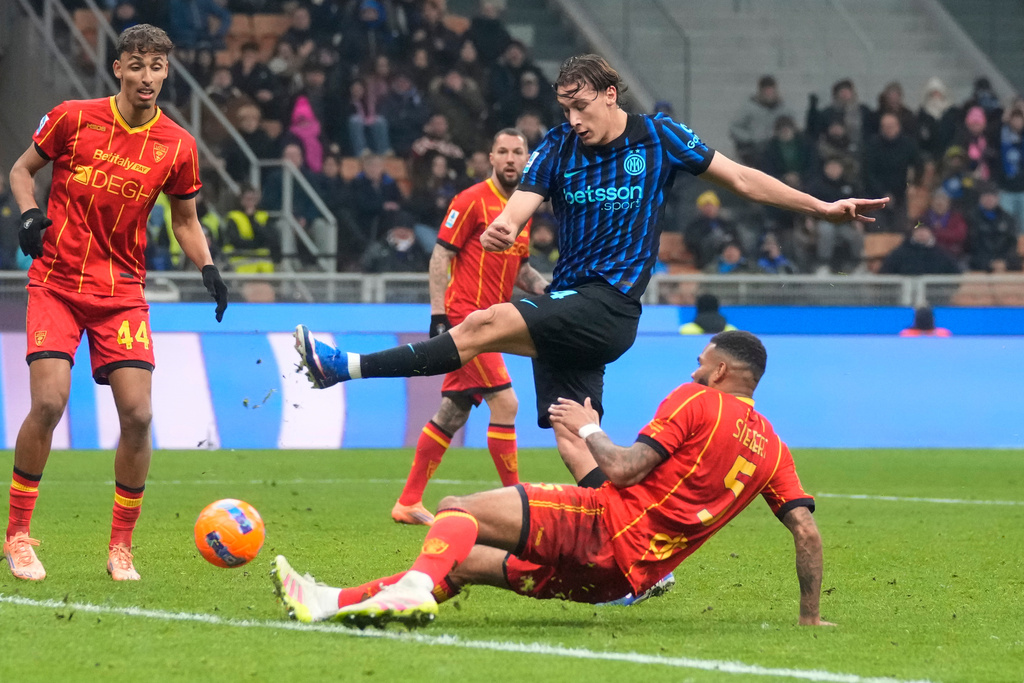 Inter Milan's Francesco Pio Esposito scores his side's opening goal during the Serie A soccer match between Inter Milan and Lecce in Milan, Italy, Wednesday, Jan. 14, 2026. (AP Photo/Luca Bruno)