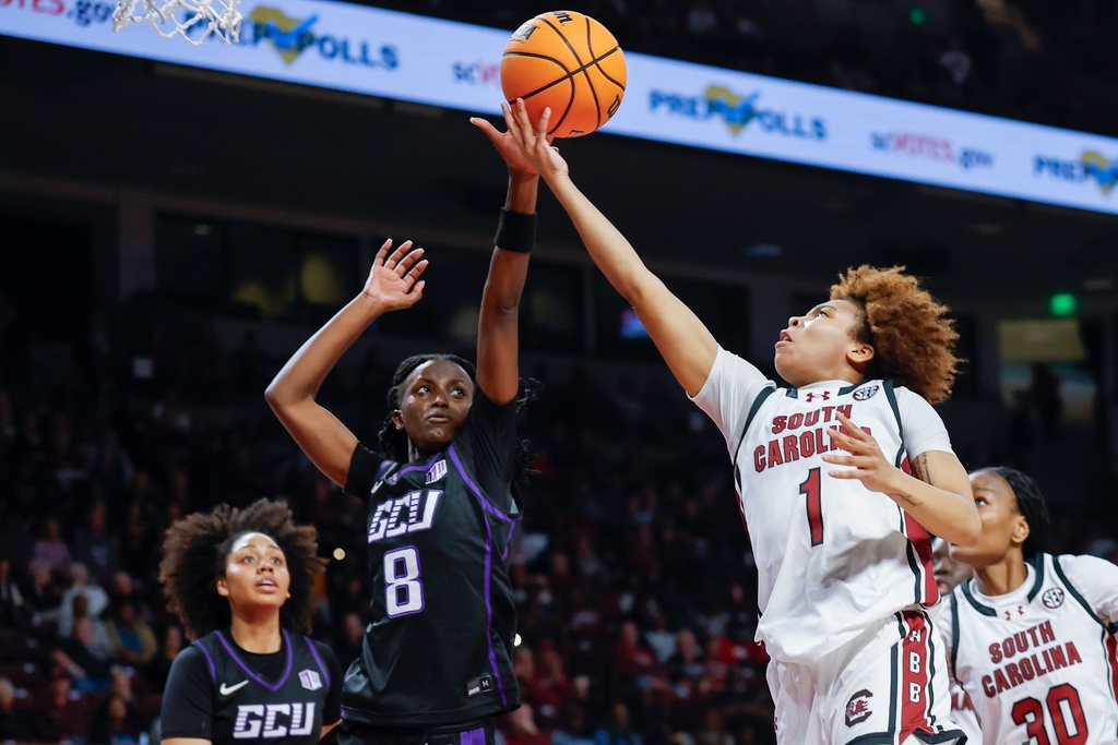 South Carolina guard Maddy McDaniel (1) drives to the basket against Grand Canyon guard Sifa Ineza during the first half of an NCAA college basketball game in Columbia, S.C., Monday, Nov. 3, 2025. (AP Photo/Nell Redmond)