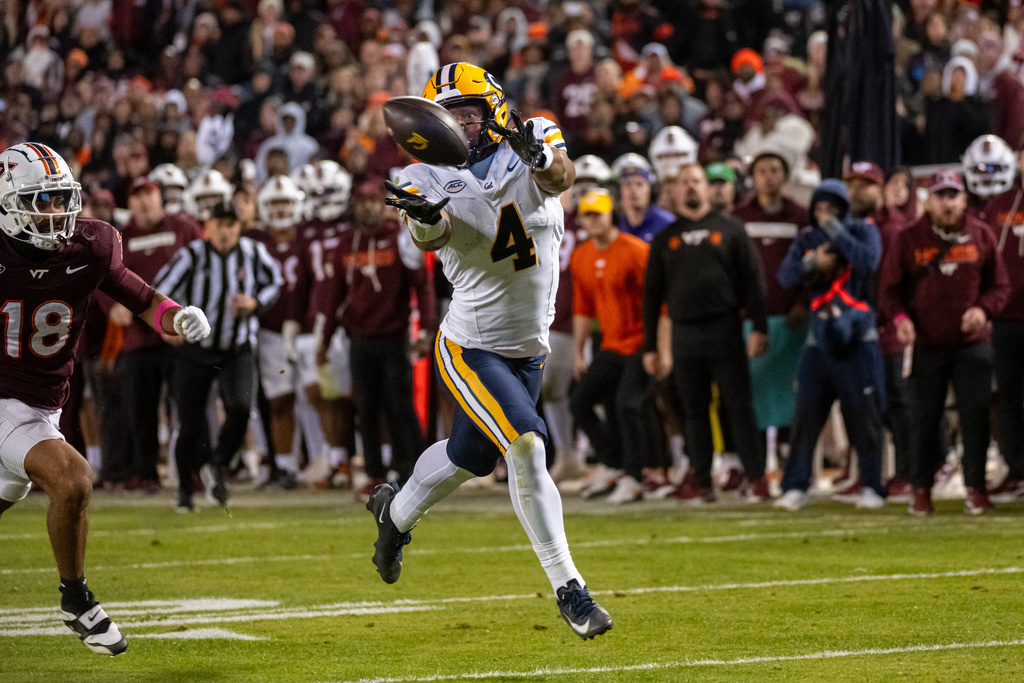 California wide receiver Jordan King (4) can't reach a pass in the endzone in the second overtime during an NCAA college football game between California and Virginia Tech, Friday Oct. 24, 2025, in Blacksburg, Va., (AP Photo/Robert Simmons)