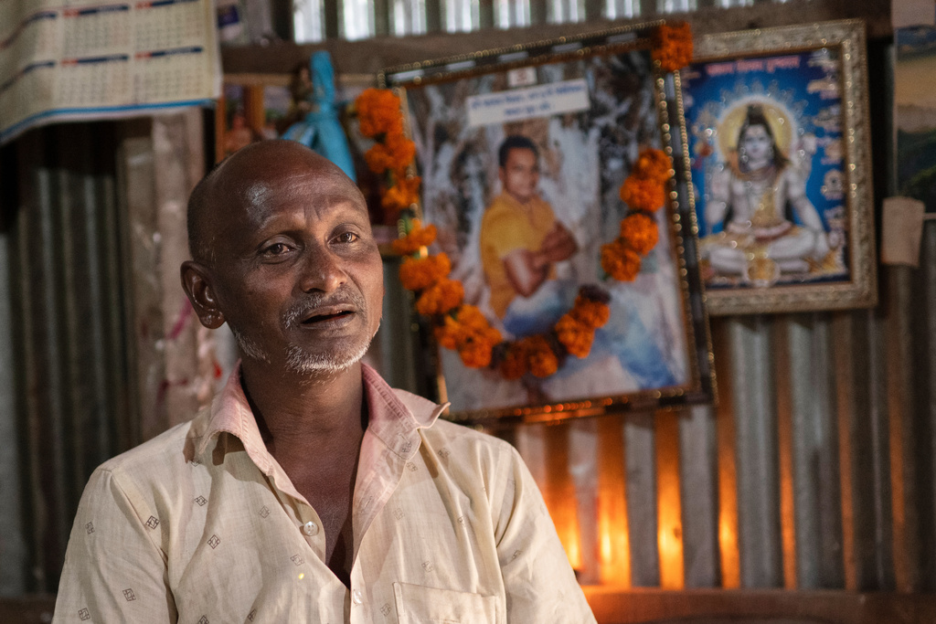 Robilal Chandra Das, father of Dipu Chandra Das, 27, speaks during an interview with The Associated Press inside his home in Tarakanda village, Mymensingh District, Bangladesh, Jan. 9, 2026. (AP Photo/Mahmud Hossain Opu)