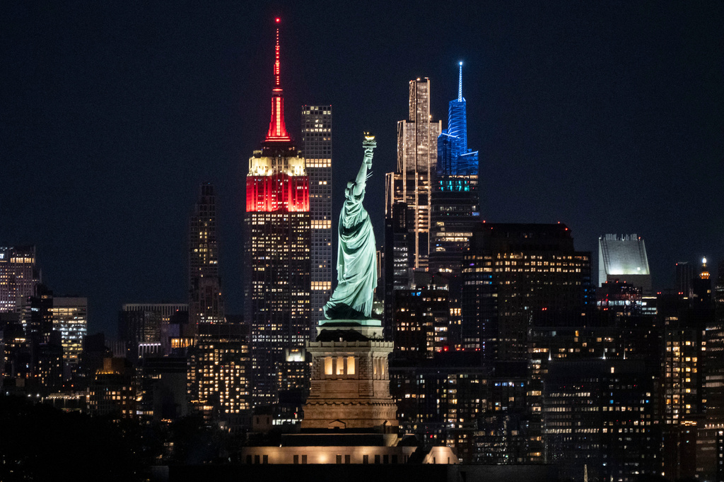 Statue of Liberty stands next to Empire State Building, left, in New York, as seen from Jersey City, N.J., Sunday, May 31, 2026 (AP Photo/Yuki Iwamura)