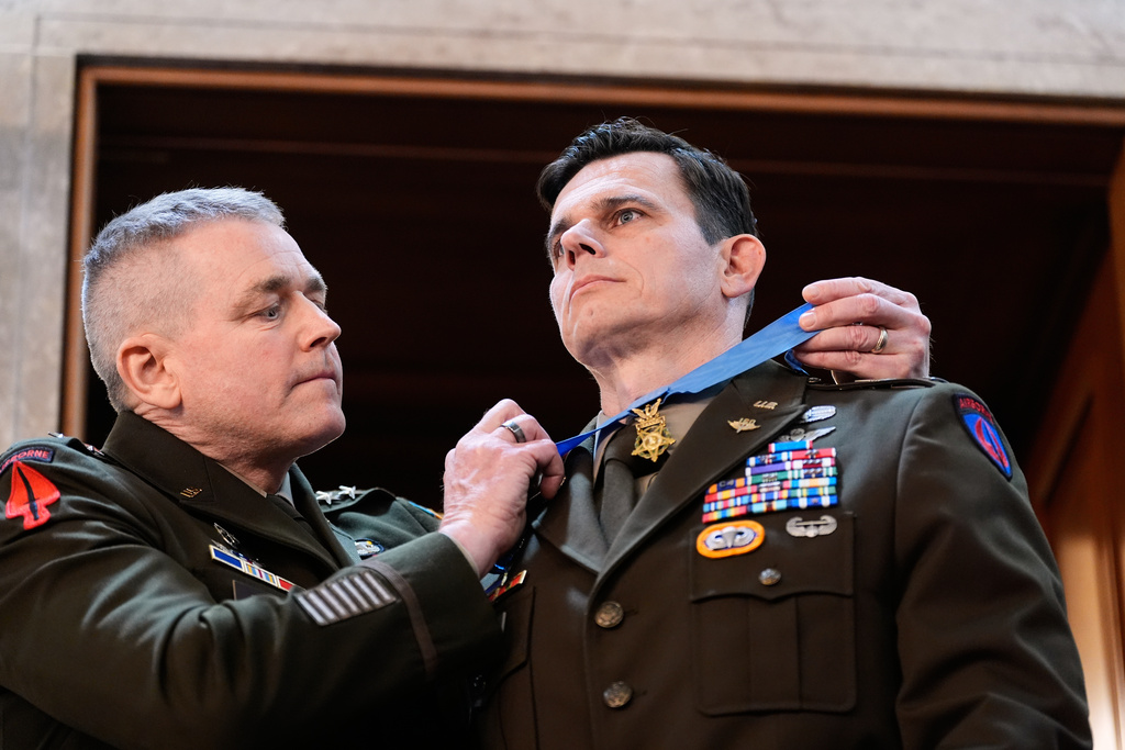 U.S. Army Chief Warrant Officer Eric Slover receives a Medal of Honor during President Donald Trump's State of the Union address to a joint session of Congress in the House chamber at the U.S. Capitol in Washington, Tuesday, Feb. 24, 2026. (AP Photo/Alex Brandon)