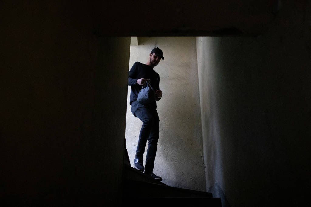 Matheus Paulo da Costa Silva leaves home for work in Rio de Janeiro, Friday, May 29, 2026. (AP Photo/Bruna Prado)