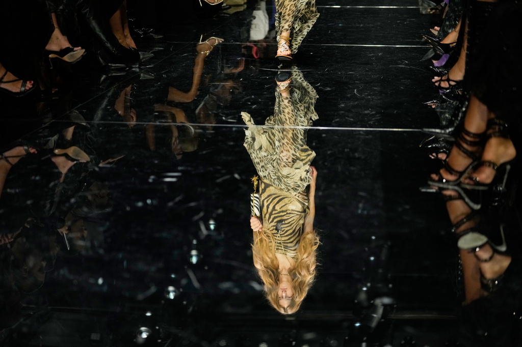 A model wears a creation part of the Roberto Cavalli women's Spring-Summer 2027 collection, presented in Milan, Italy, Thursday, Sept. 24, 2026. (AP Photo/Luca Bruno).