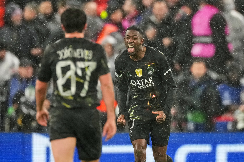 PSG's Ousmane Dembele celebrates after scoring his side's opening goal during the Champions League quarterfinal second leg soccer match between Liverpool and Paris Saint-Germain in Liverpool, England, Tuesday, April 14, 2026. (AP Photo/Dave Shopland)
