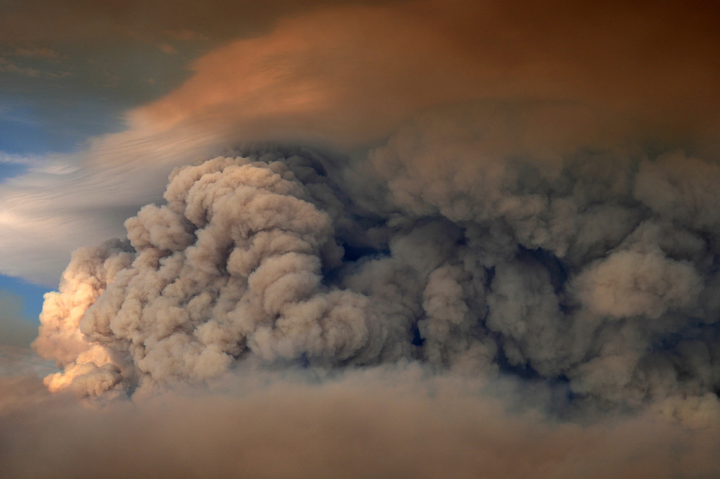 A plumes of smoke from the Camp Fire hang in the air over Moose Lake as multiple wildfires burn in Minnesota's Boundary Waters Canoe Area Wilderness, Tuesday, July 14, 2026. (Anthony Souffle/Minnesota Star Tribune via AP)