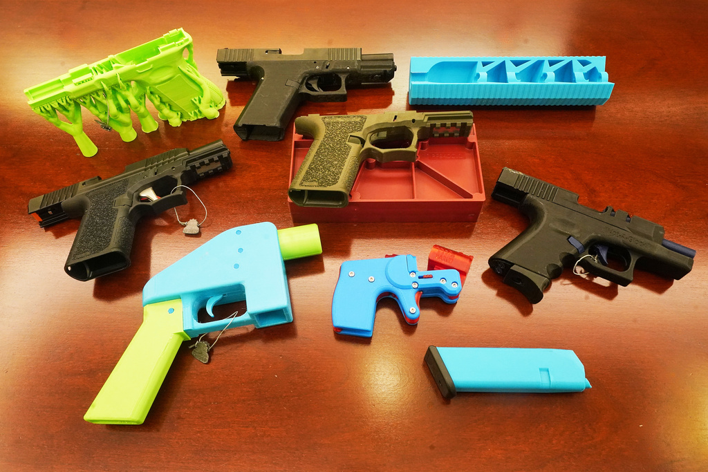 Ghost guns, provided by the New York City Police Department, are displayed in the Manhattan District Attorney's office, in New York, Wednesday, Oct. 15, 2025. (AP Photo/Richard Drew)