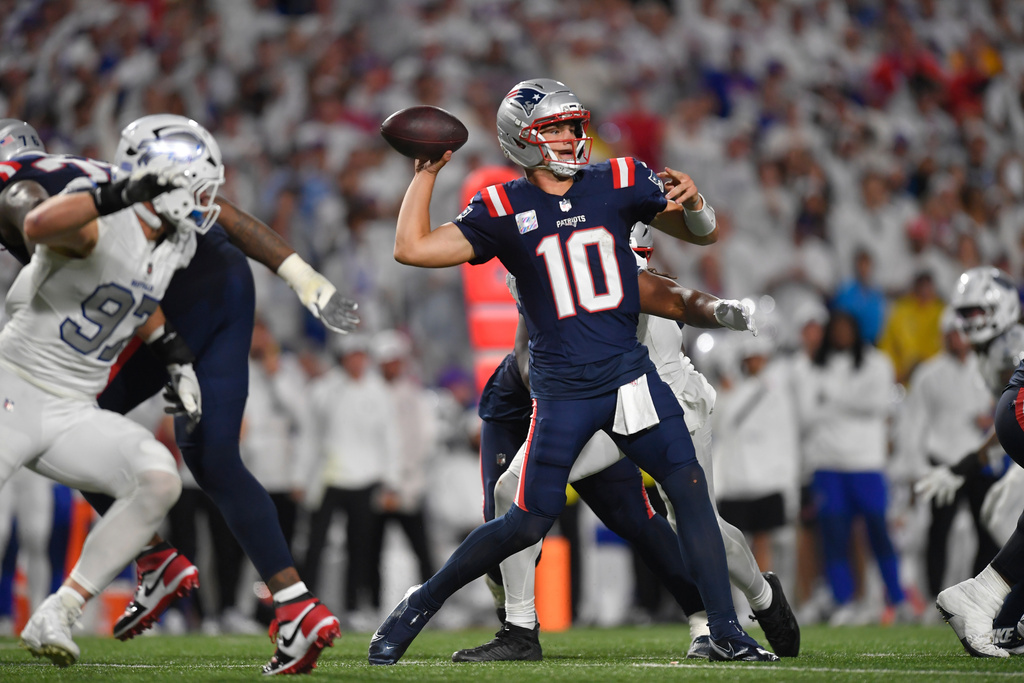 New England Patriots quarterback Drake Maye (10) throws against the Buffalo Bills during the second half of an NFL football game, Sunday, Sept. 5, 2025, in Orchard Park, N.Y. (AP Photo/Adrian Kraus)