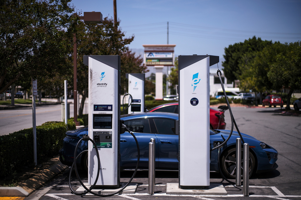 FILE - An electric vehicle charges at an Electrify America station in Arcadia, Calif., May 22, 2025. (AP Photo/Jae C. Hong, File)