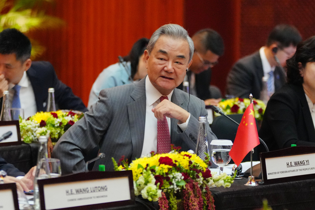China's Foreign Minister Wang Yi attends the Comprehensive Strategic Dialogue between Indonesia and China in Jakarta, Indonesia, Friday, Aug. 21, 2026. (AP Photo/Tatan Syuflana)