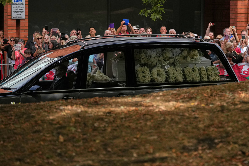 The hearse with the coffin arrives at Swansea Minster for the funeral of Bonnie Tyler in Swansea, Wales, Monday, Aug. 17, 2026. (AP Photo/Alastair Grant)