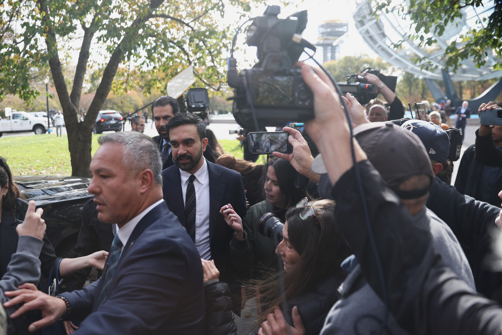 New York City mayor-elect Zohran Mamdani is surrounded by members of the news after a news conference in the Queens borough of New York, Wednesday, Nov. 5, 2025. (AP Photo/Heather Khalifa)