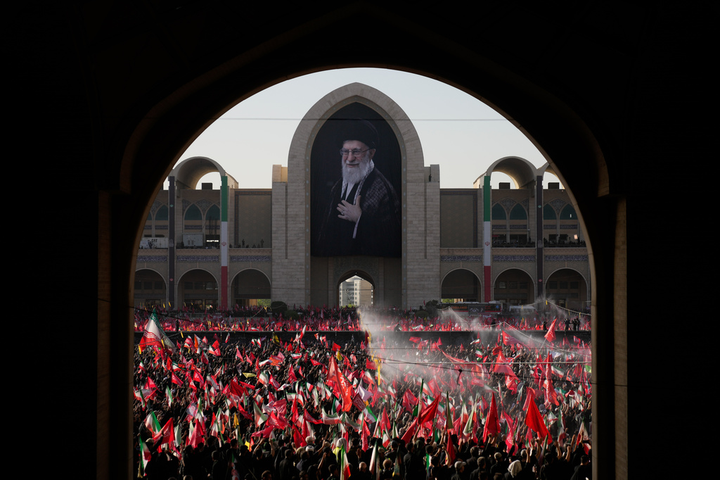 Mourners attend funeral prayers held as part of the dayslong funeral service for the slain Iranian Supreme Leader Ayatollah Ali Khamenei and members of his family at the Imam Khomeini Mosalla Grand Mosque in Tehran, Iran, Sunday, July 5, 2026. (AP Photo/Altaf Qadri)