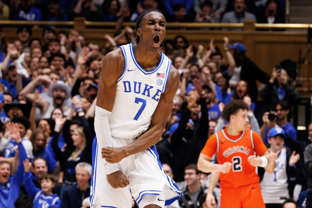 Duke's Dame Sarr (7) reacts after hitting a 3-pointer during the first half of an NCAA college basketball game against Virginia in Durham, N.C., Saturday, Feb. 28, 2026. (AP Photo/Ben McKeown)